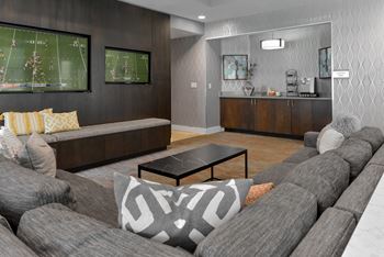 a living room with couches and a coffee table at The Pointe at St. Joseph Apartments, South Bend, IN, 46617